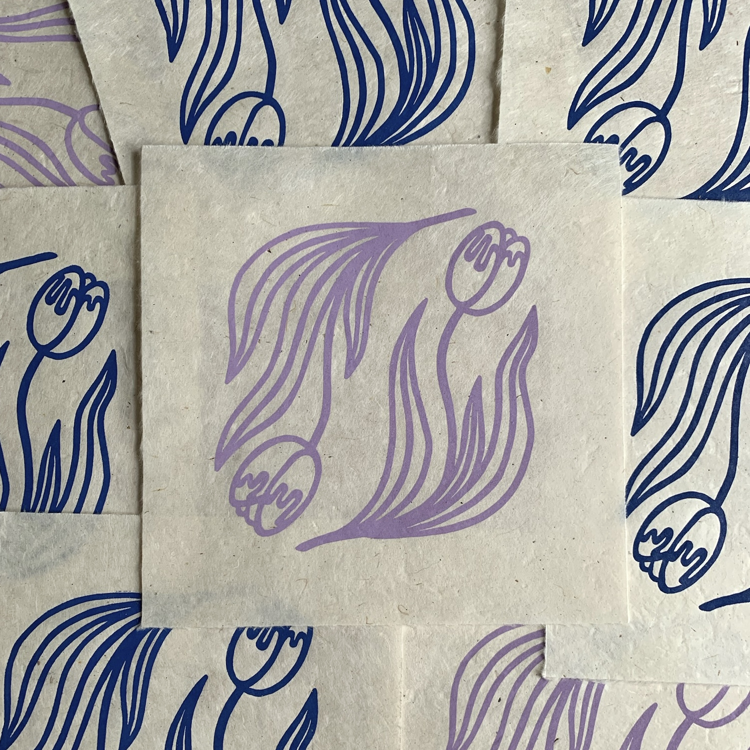 Eight prints of double tulips in lilac and blue colorways