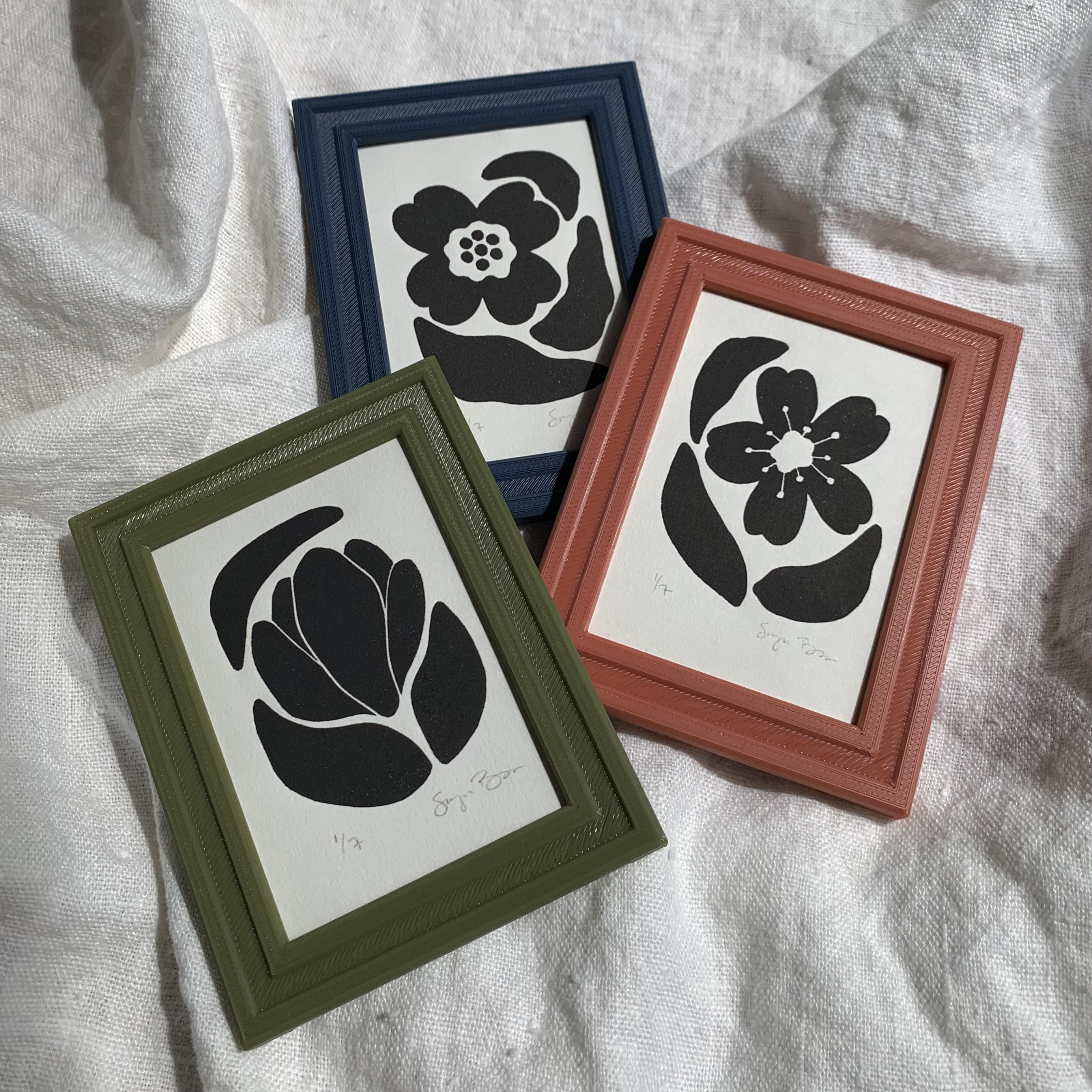 Three framed mini prints each with a minimalist spring flower design